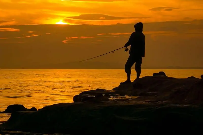 Man fishing on jetty