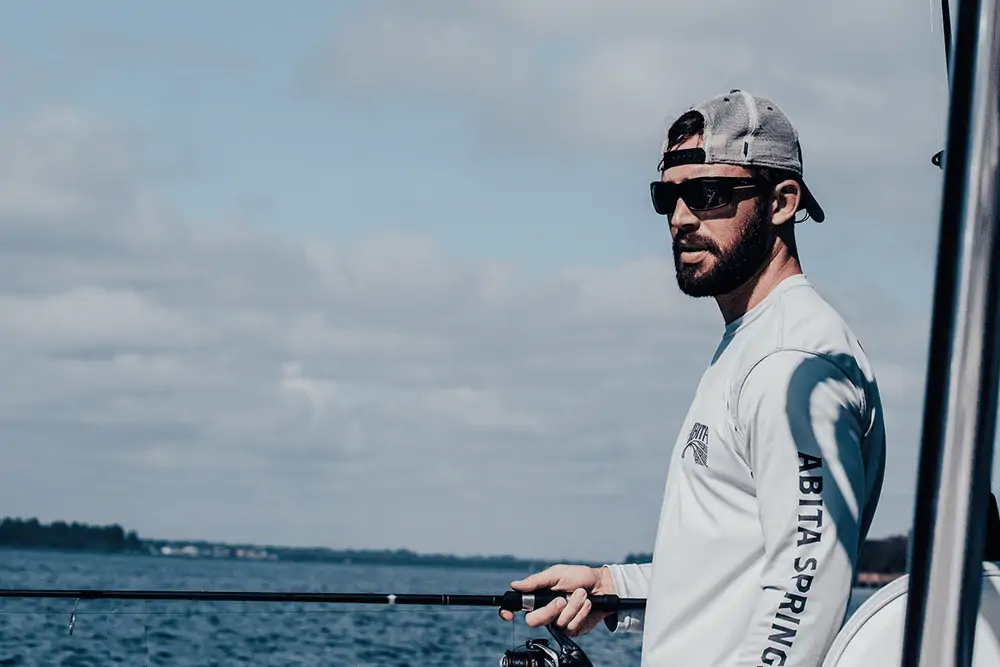 guy fishing on a boat
