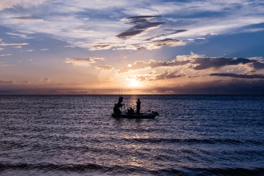 boat fishing at sunrise