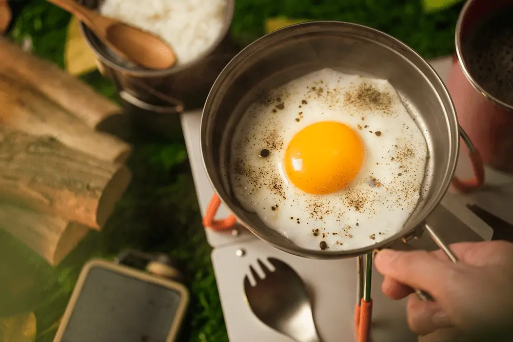 Cooking egg while camping