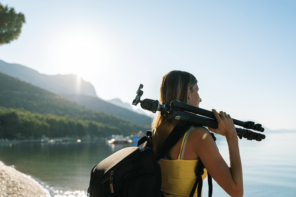 photographer holding a tripod