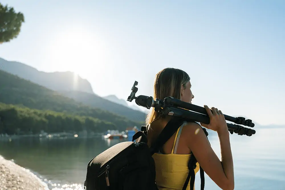 photographer holding a tripod