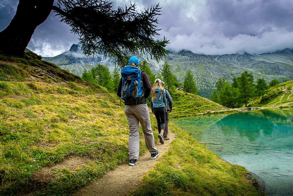 friends hiking down a trail