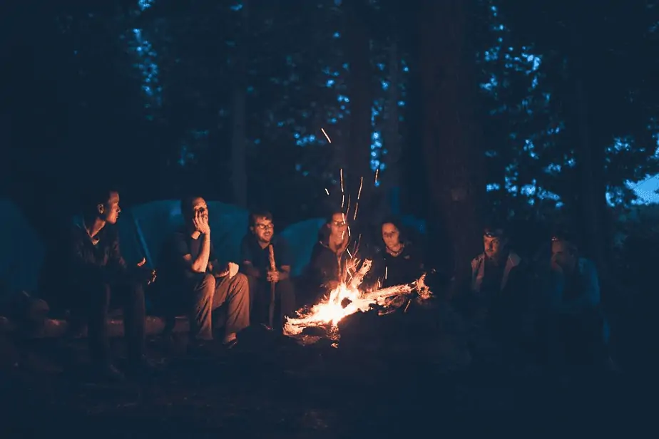 Group of people around campfire