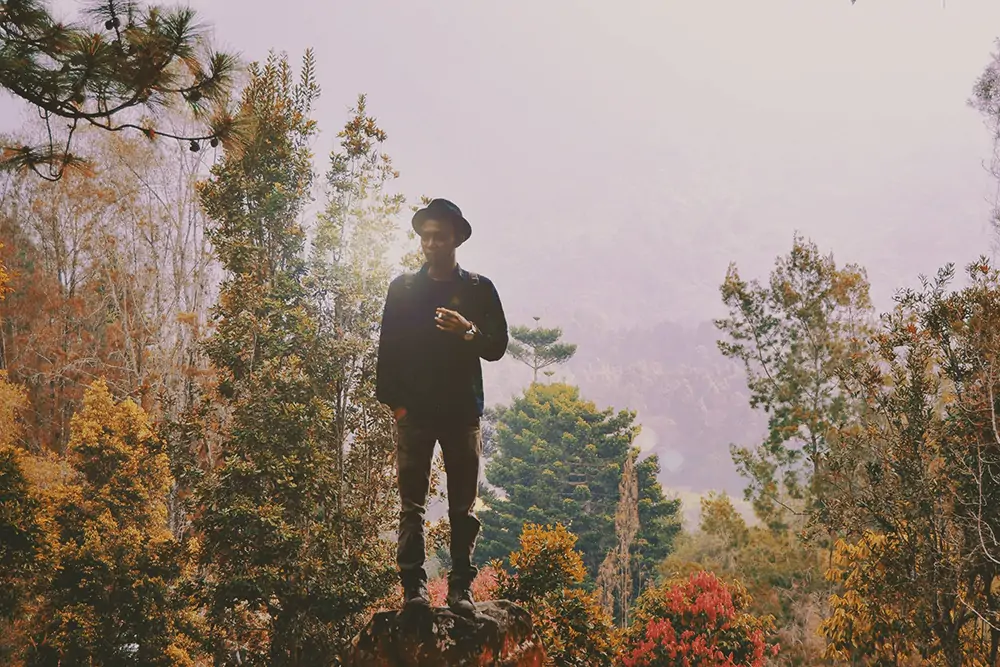 guy smoking on a hike