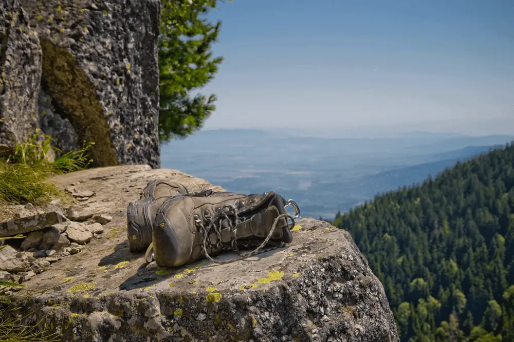 hiking boots laid on a rock ledge