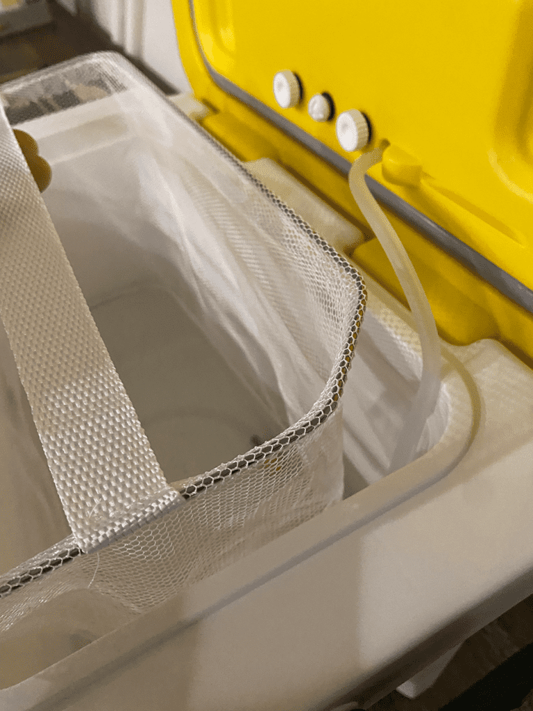 lift-out net liner with bent corners for air hose.