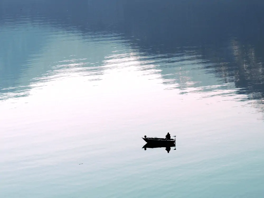 man fishing on a boat