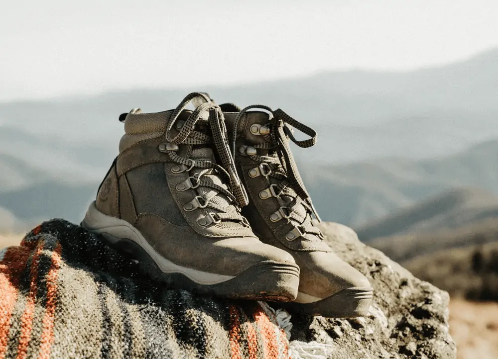 Pair of hiking boots on a rock