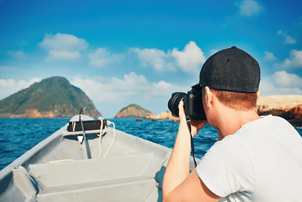 Young photographer on a boat