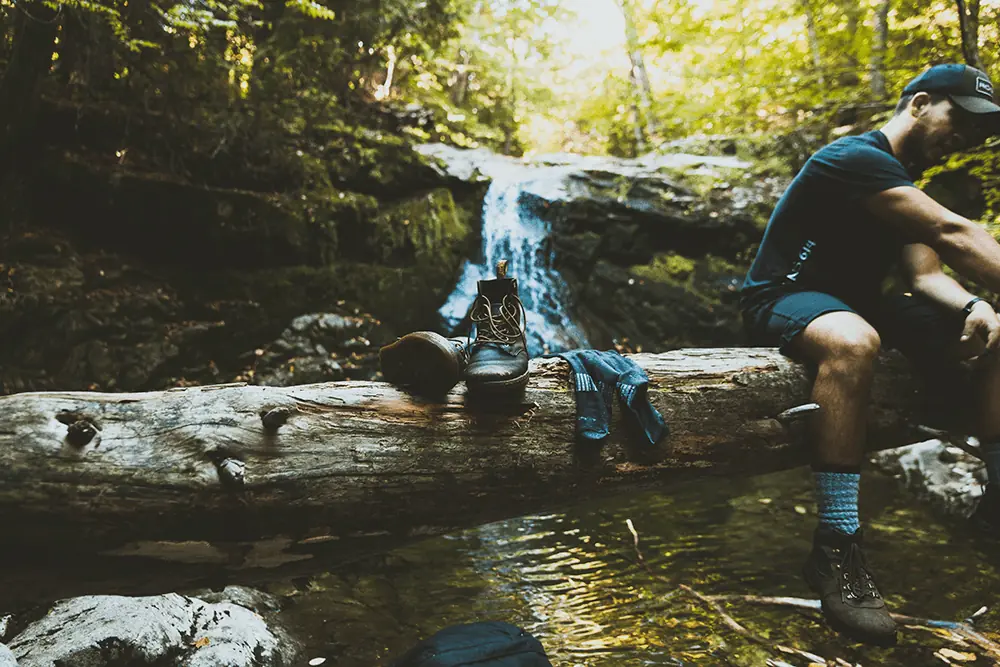 hiker sitting on log