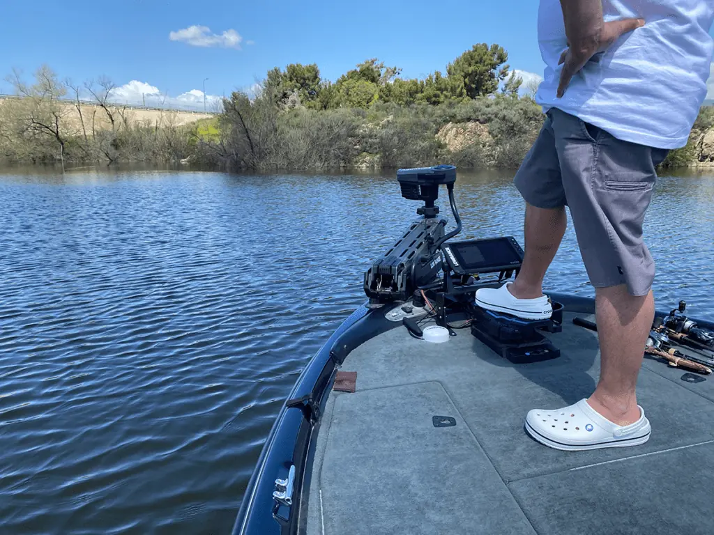 fishing boat with trolling motor on lake